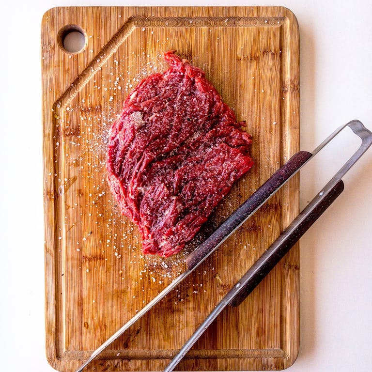 Brown Wooden Chopping Board With Meat On Top Brown Wooden Chopping Board With Meat On Top